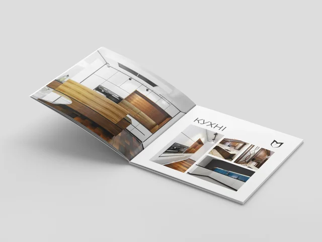 Open furniture catalogue with kitchen photography
